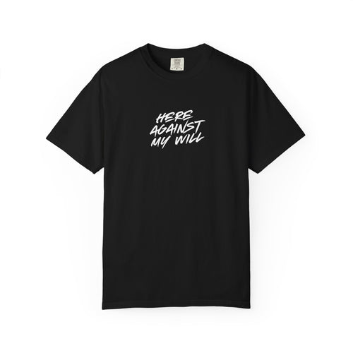Black t-shirt with white text 'HERE AGAINST MY WILL' on a white background