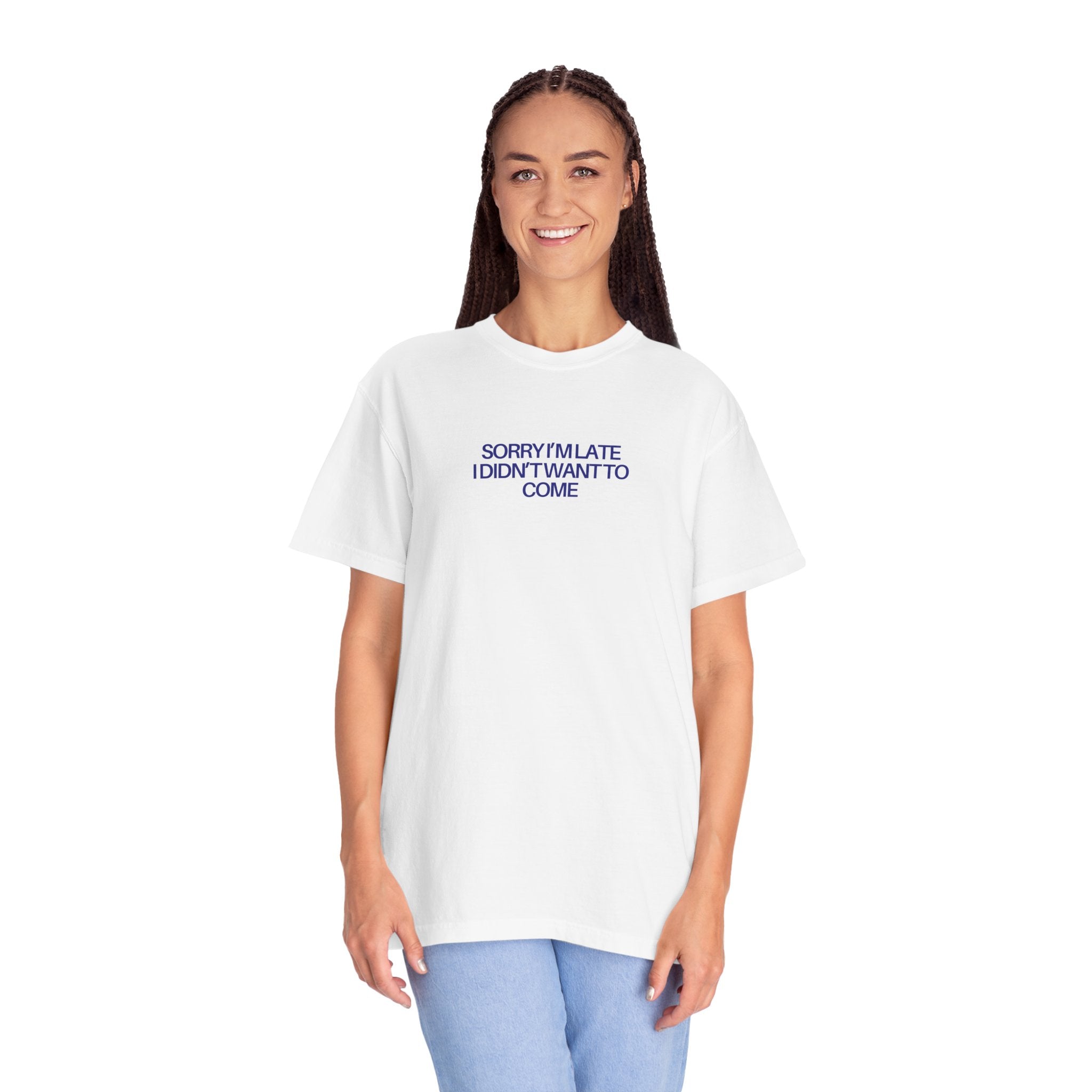 Woman wearing a white t-shirt with blue text 'SORRY I'M LATE I DIDN'T WANT TO COME'