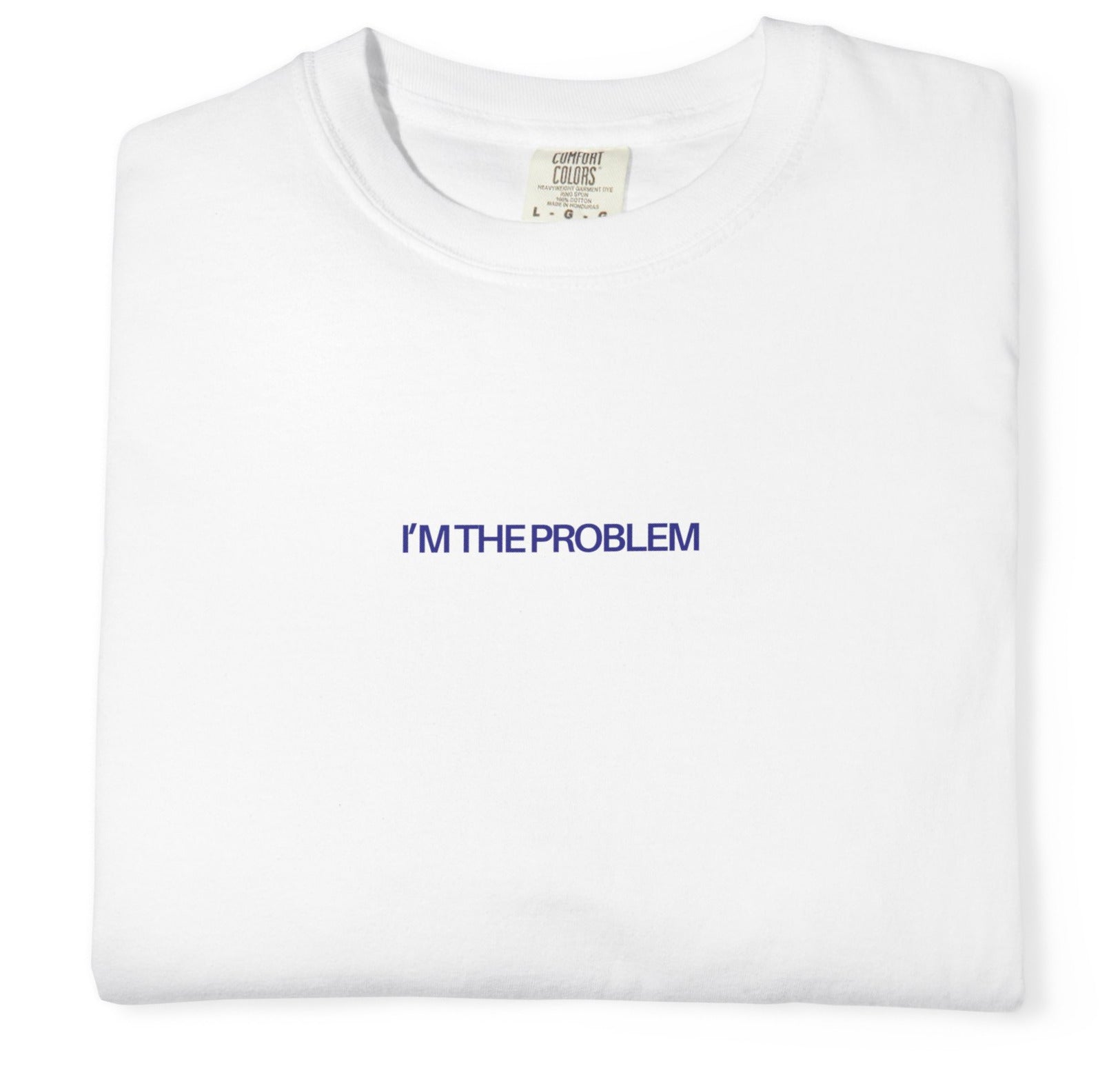 White t-shirt with 'I'm the Problem' text in blue on a white background