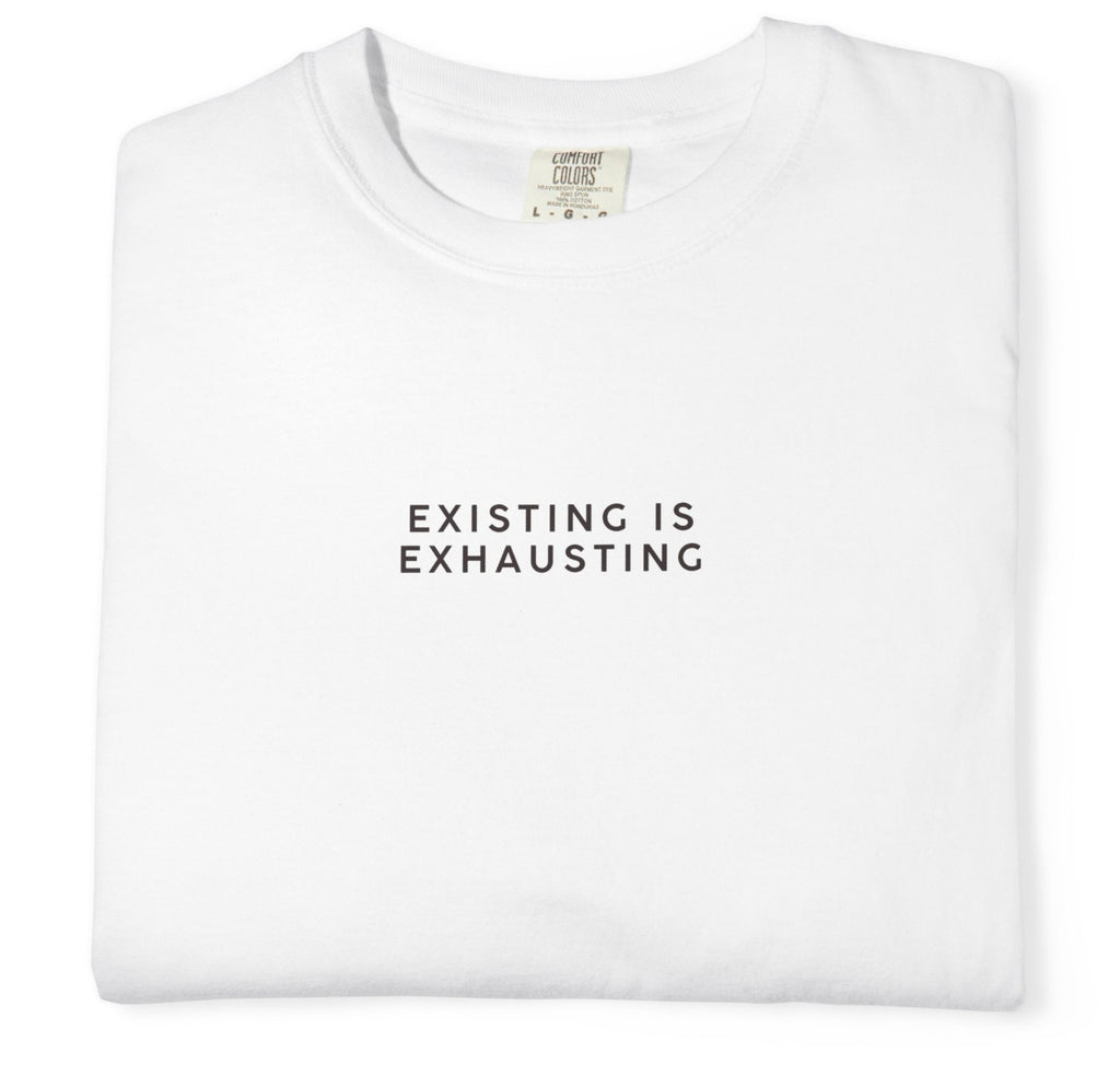 White t-shirt with 'EXISTING IS EXHAUSTING' text on a white background