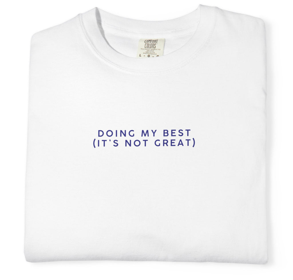 White t-shirt with text 'DOING MY BEST (IT'S NOT GREAT)' on a white background